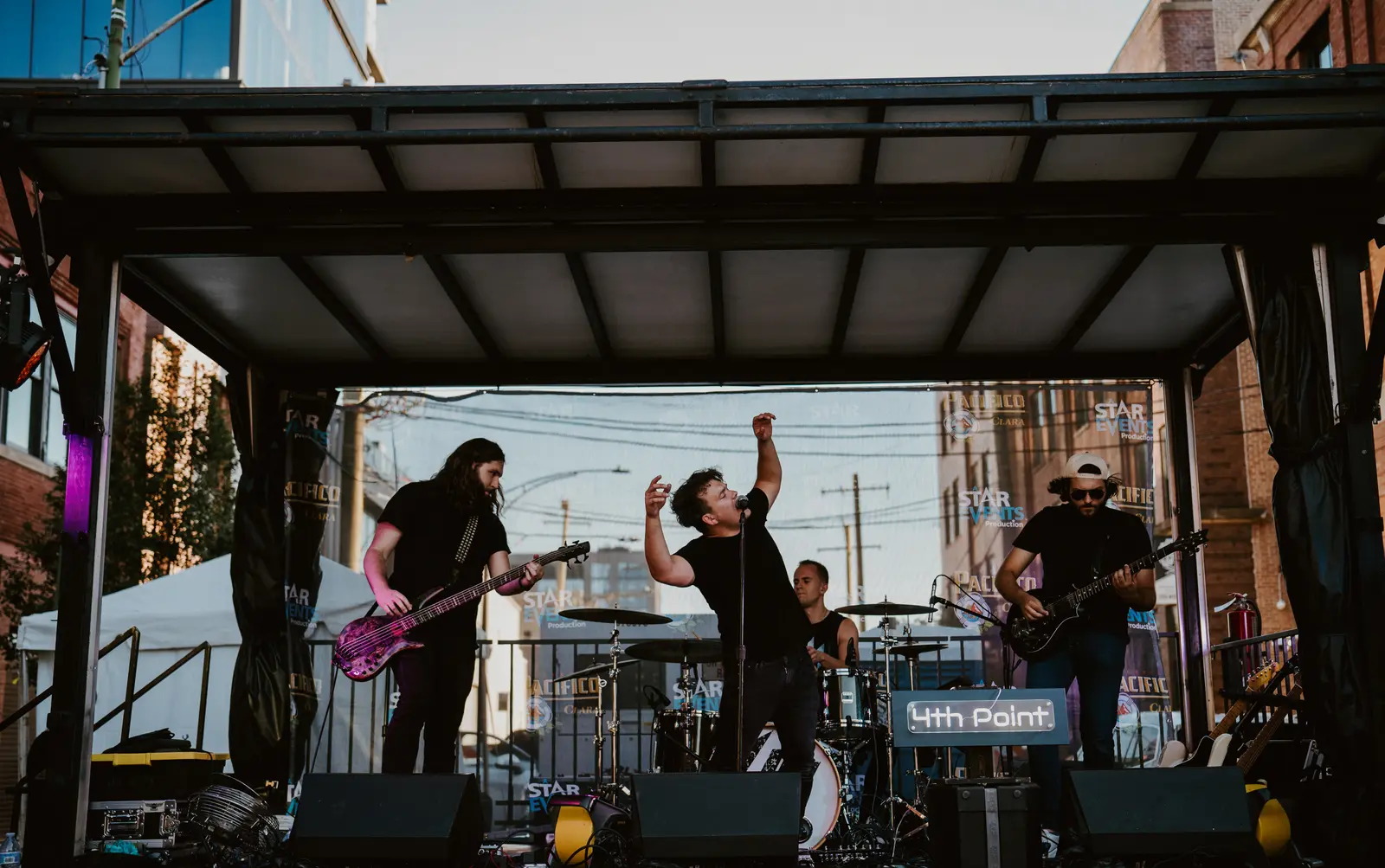 4th Point performing on an outdoor festival stage
